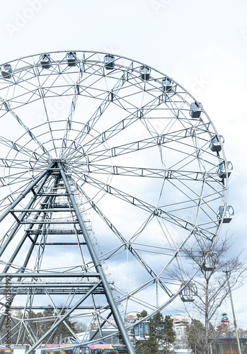 ferris or observation wheel over a blue sky