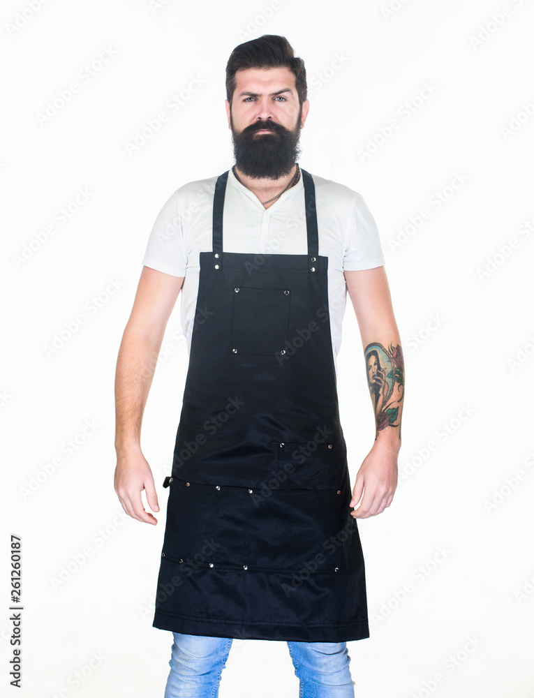Waiter or bartender. Ready serve drink. Bearded hipster wear apron. Man cook brutal hipster. Fast food restaurant. Serious bearded cook. Restaurant staff. Hipster professional barista apron uniform Waiter or bartender. Ready serve drink. Bearded hipster wear apron. Man cook brutal hipster. Fast food restaurant. Serious bearded cook. Restaurant staff. Hipster professional barista apron uniform