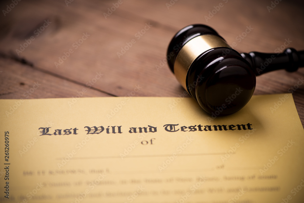 Last will and testament form with gavel. Decision, financial