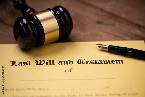 Last will and testament form with gavel. Decision, financial