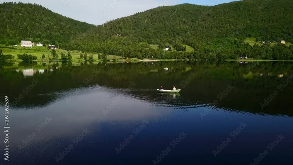 Aerial Circling: Boat on Beautiful Lake Among Scenic Green Mountains in Senja Island, Norway