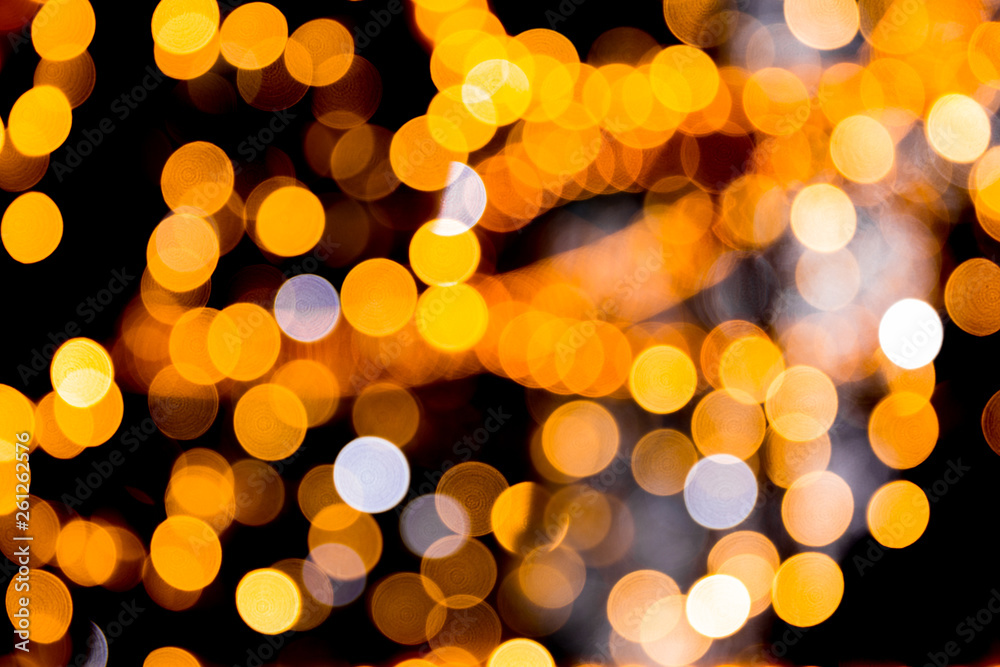 Unfocused abstract orange bokeh on black background. defocused and blurred many round light Unfocused abstract orange bokeh on black background. defocused and blurred many round light
