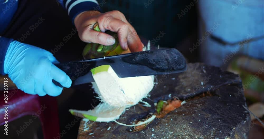 Coconut Cleaning Technique, Female Hands Cut Coconut Machete. Woman