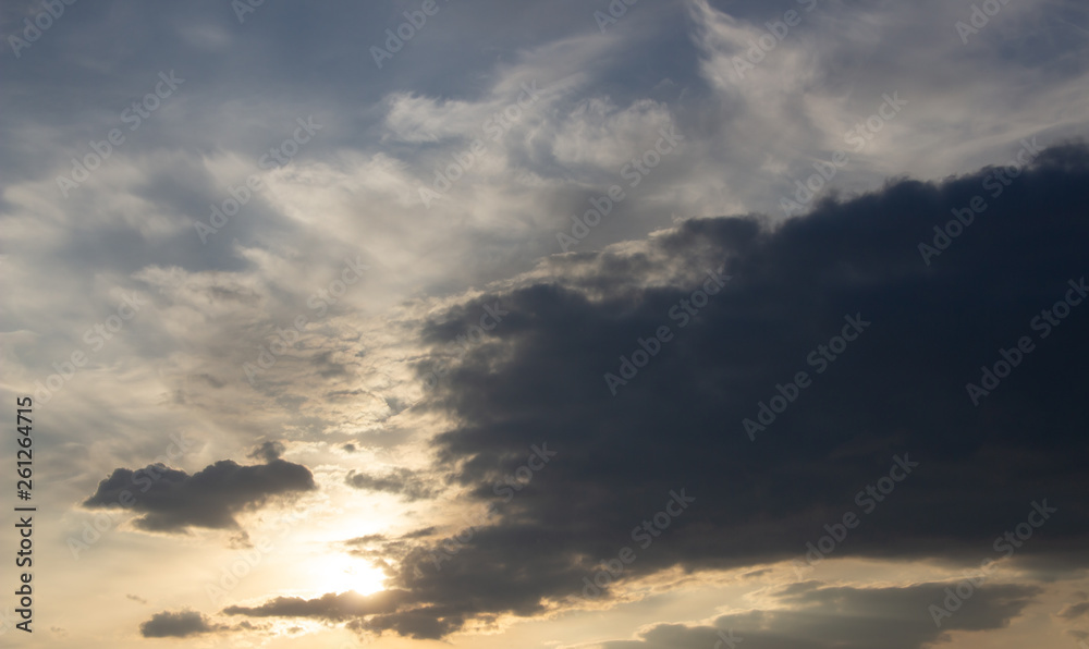Fototapeta premium Beautiful sunset in the clouds, bright sun
