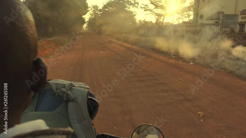 POV: Motorcycle Drives through outskirts of Kampala, Uganda, Africa. sunset time