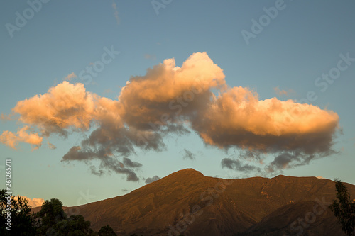 Multiple exposure of fluffy yellow clouds over Iguaque mountain, near the colonial town of Villa de Leyva, in the central Andes of Colombia.