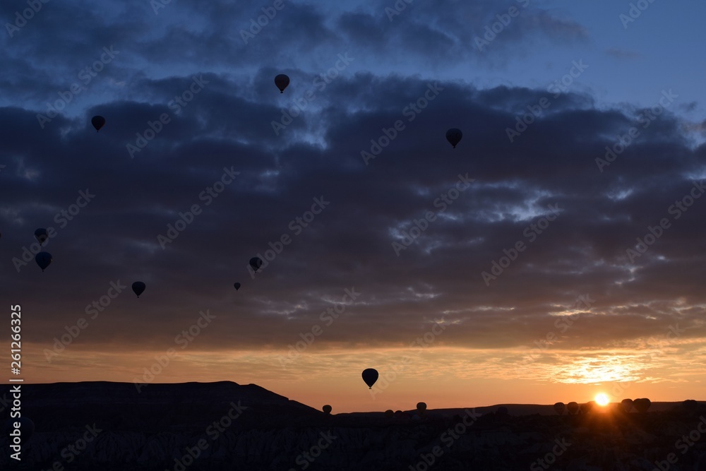 Sunrise and balloons. Beautiful background of the balloon and the sunset.Cappadocia. Turkey. Göreme. Nevşehir. Türkiye. Sunrise and balloons. Beautiful background of the balloon and the sunset.Cappadocia. Turkey. Göreme. Nevşehir. Türkiye.