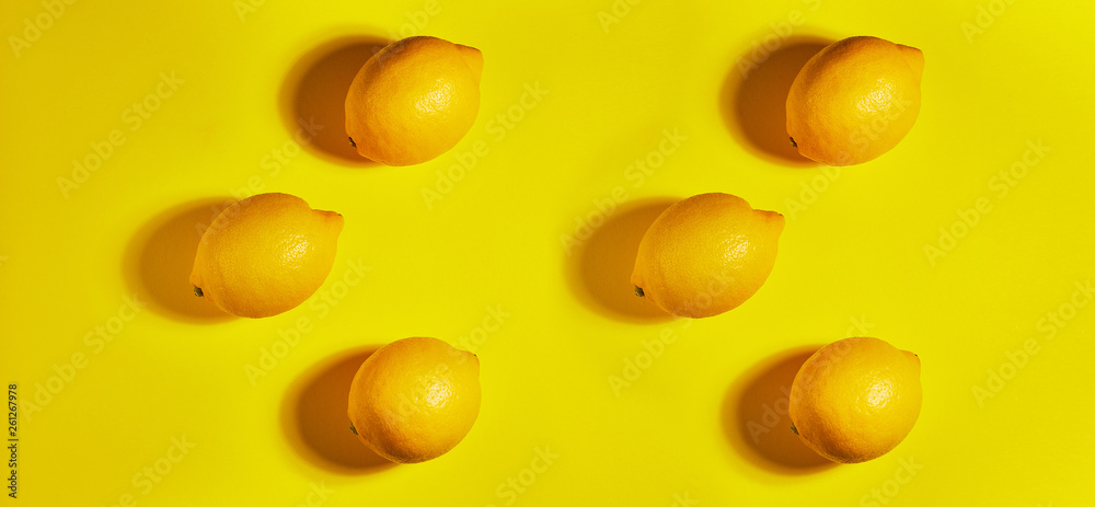 Lemon on yellow background. Flat lay, top view, copy space . Food concept.