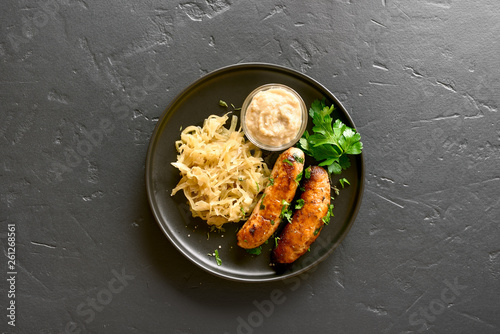 Grilled sausages with sauerkraut and horseradish
