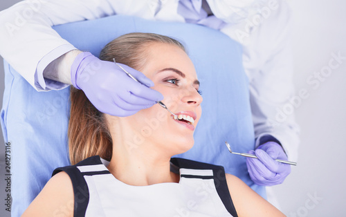 beautiful girl in the dental chair on the examination at the de