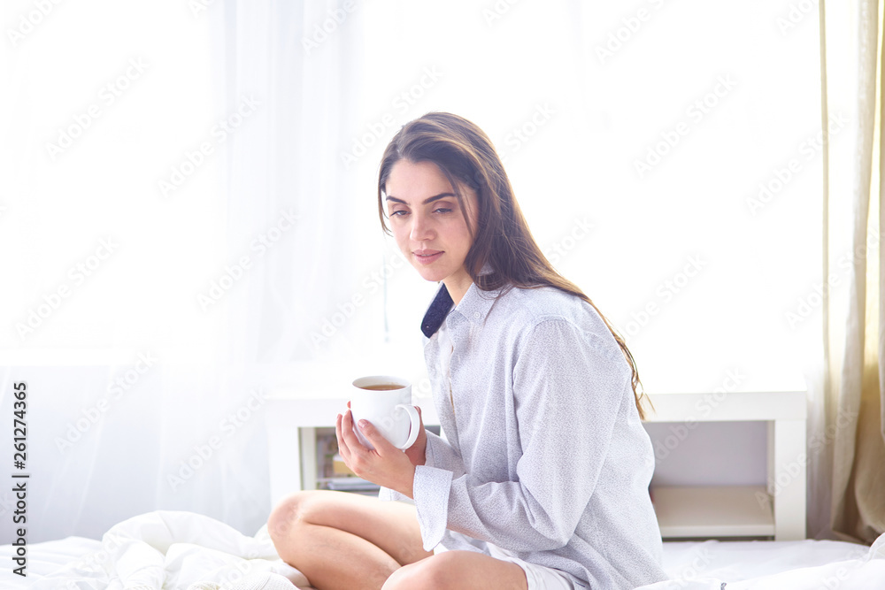 Young beautiful happy brunette woman in black silk dressing gow Young beautiful happy brunette woman in black silk dressing gow