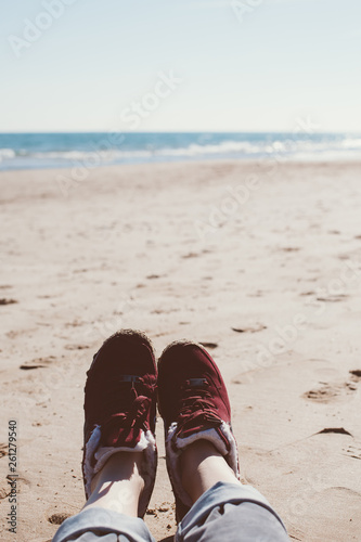 Girl relaxing on sand beach