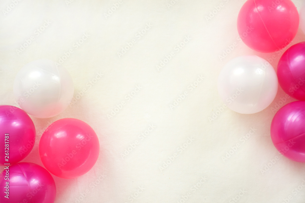 Two groups of pink and white balloons on a white background with copy space.