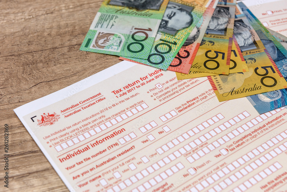 Naklejka premium Australian taxation company, individual form with aud banknotes