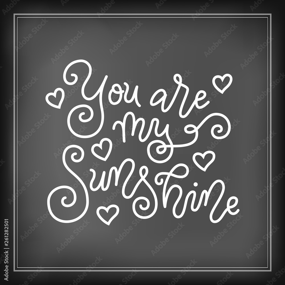 Modern mono line calligraphy lettering of You are my sunshine in white on chalkboard background with hearts