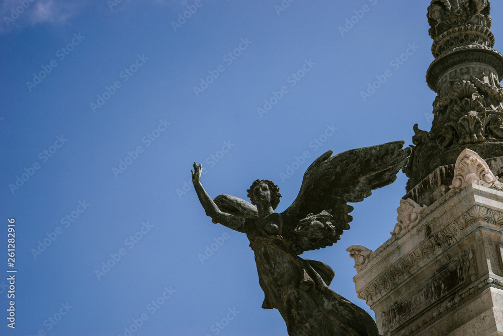 ROME, ITALY - 12 SEPTEMBER 2018: Winged sculptures on the memorial architectural complex of XVIII-XIX centuries in honor of king Victor Emmanuel