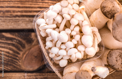 fresh different mushrooms in a wooden basket close-up