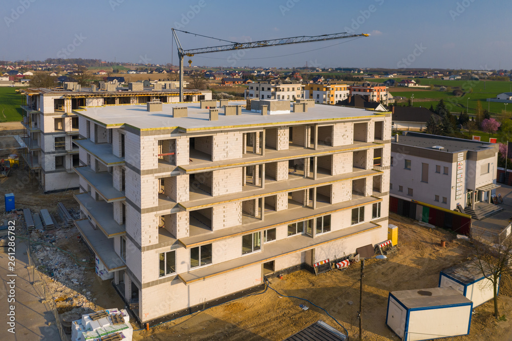 Multi-family building under construction, aerial view.