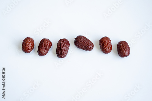 Red dried Jujubes isolated in white background, health food