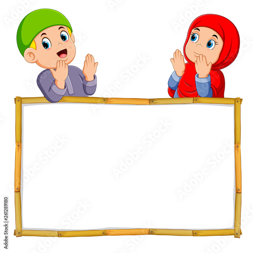 the two children are praying above the wooden blank banner