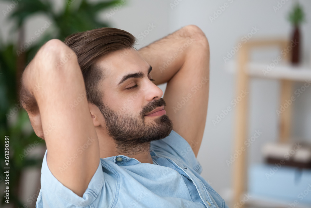 Close up tired peaceful man relaxing leaning back with closed eyes Close up tired peaceful man relaxing leaning back with closed eyes