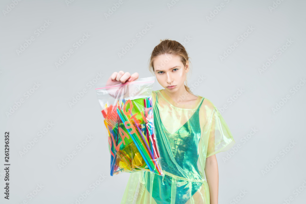 Serious model encouraging people not to use plastic in huge amount Serious model encouraging people not to use plastic in huge amount