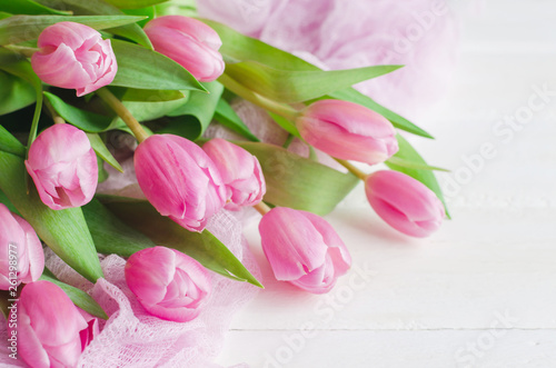 Fototapeta Naklejka Na Ścianę i Meble -  Spring flower. Bunch of Pink tulips place on white wooden background.