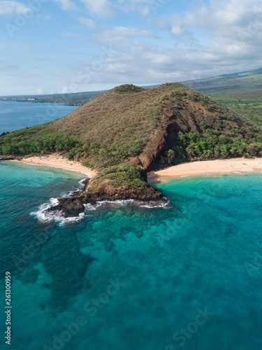 Isolated island with two beach with blue turquoise water with white sand beach. Aerial shot. Hawaii, Maui. Big beach. French Polynesia Tropical paradise