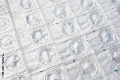 Packed contact lenses in disposable plastic containers. Close up. Selective focus.