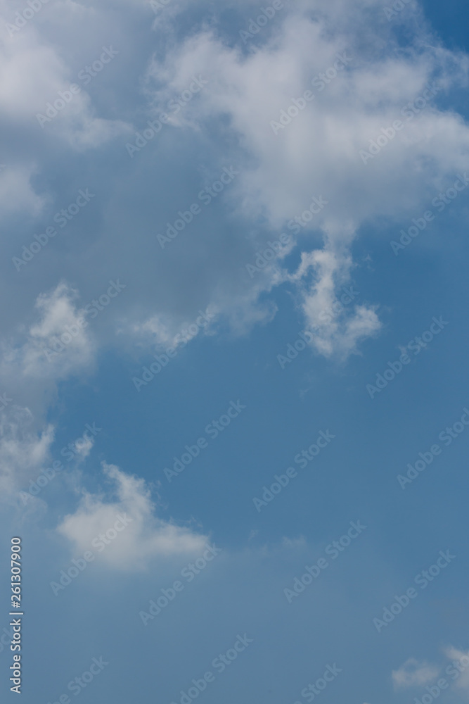 fluffy white cloud above clear blue sky background fluffy white cloud above clear blue sky background