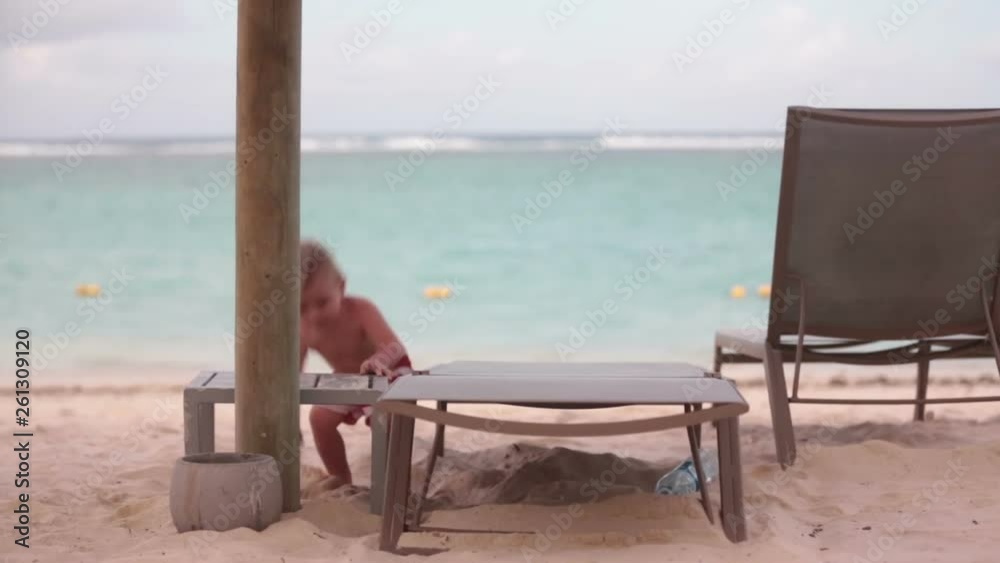 Happy beautiful child, enjoying the sunset on the beach in Mauritius, famiy joyful vacation Happy beautiful child, enjoying the sunset on the beach in Mauritius, famiy joyful vacation