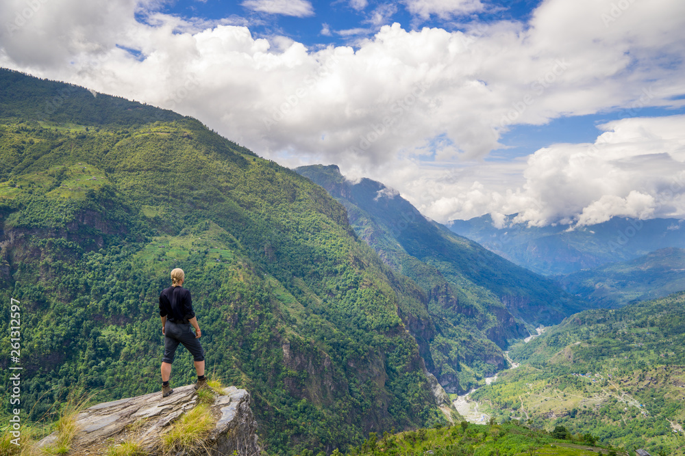 Man standing on hill top in Himalayas