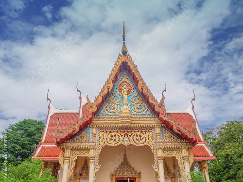 Beautiful Gable on top of buddhist temple with cloudy sky background, Wat Pho Banlang, Ban Pong, Ratchaburi, Thailand.
