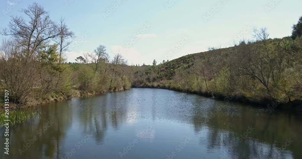 Aerial view by drone, with river landscape, Vouga river on valley and banks with typical Portuguese vegetation, on the mountains, in north Portugal Aerial view by drone, with river landscape, Vouga river on valley and banks with typical Portuguese vegetation, on the mountains, in north Portugal