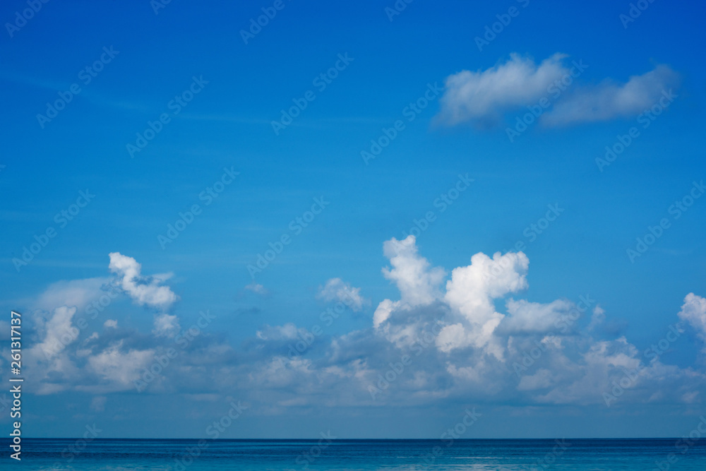 The vast blue sky and clouds sky in summer. The sky is bright with a lot of clouds and it feels good. so beautiful sky image. In the sea