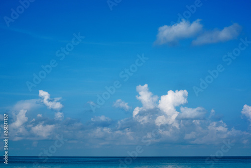 The vast blue sky and clouds sky in summer. The sky is bright with a lot of clouds and it feels good. so beautiful sky image. In the sea