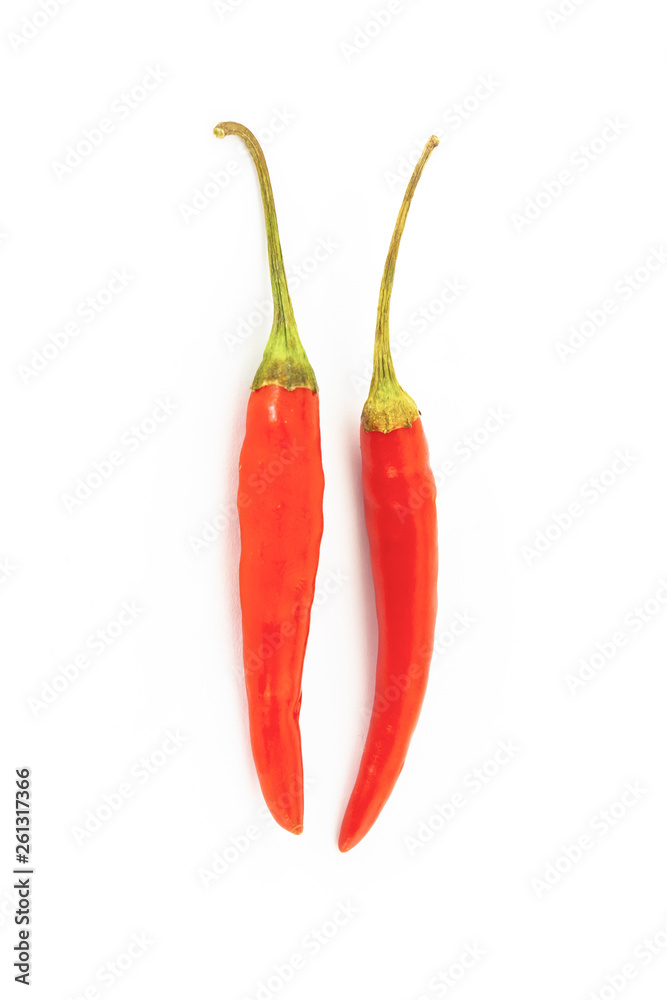 pair of hot red chili peppers thin pods of a couple of vegetables on a white background isolated pair of hot red chili peppers thin pods of a couple of vegetables on a white background isolated