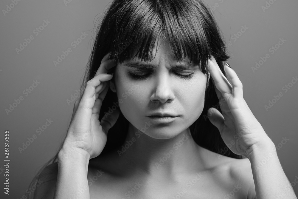 Troubled young lady. Anxious facial expression. Black and white closeup portrait of emotional brunette woman. Troubled young lady. Anxious facial expression. Black and white closeup portrait of emotional brunette woman.