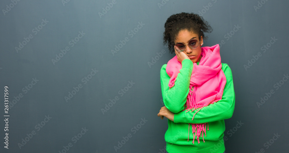 Young african american girl with blue eyes tired and very sleepy Young african american girl with blue eyes tired and very sleepy