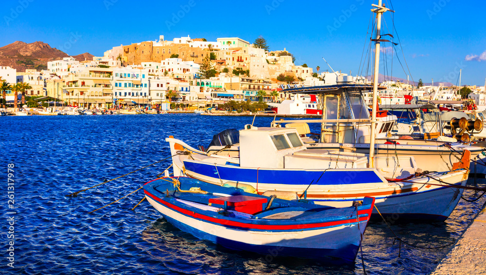 Obraz premium Greek holidays - scenic port of Naxos island, view with old fishing boats, Cyclades, Greece