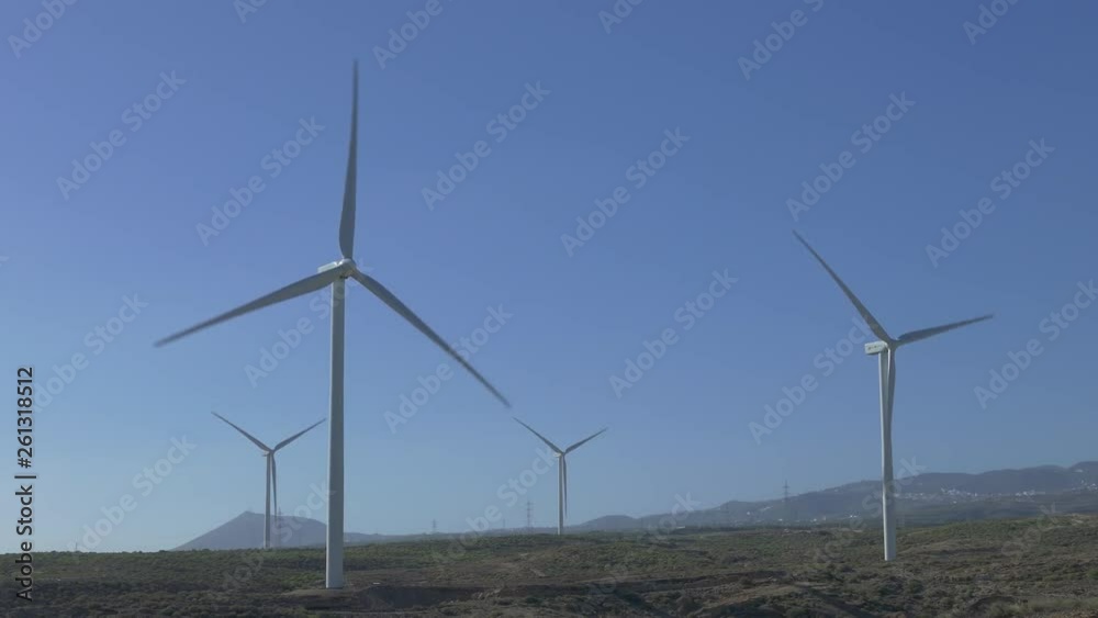 Wind turbines with rotating blades on Tenerife, Canary Islands...Unmodified camera color. Wind turbines with rotating blades on Tenerife, Canary Islands...Unmodified camera color.