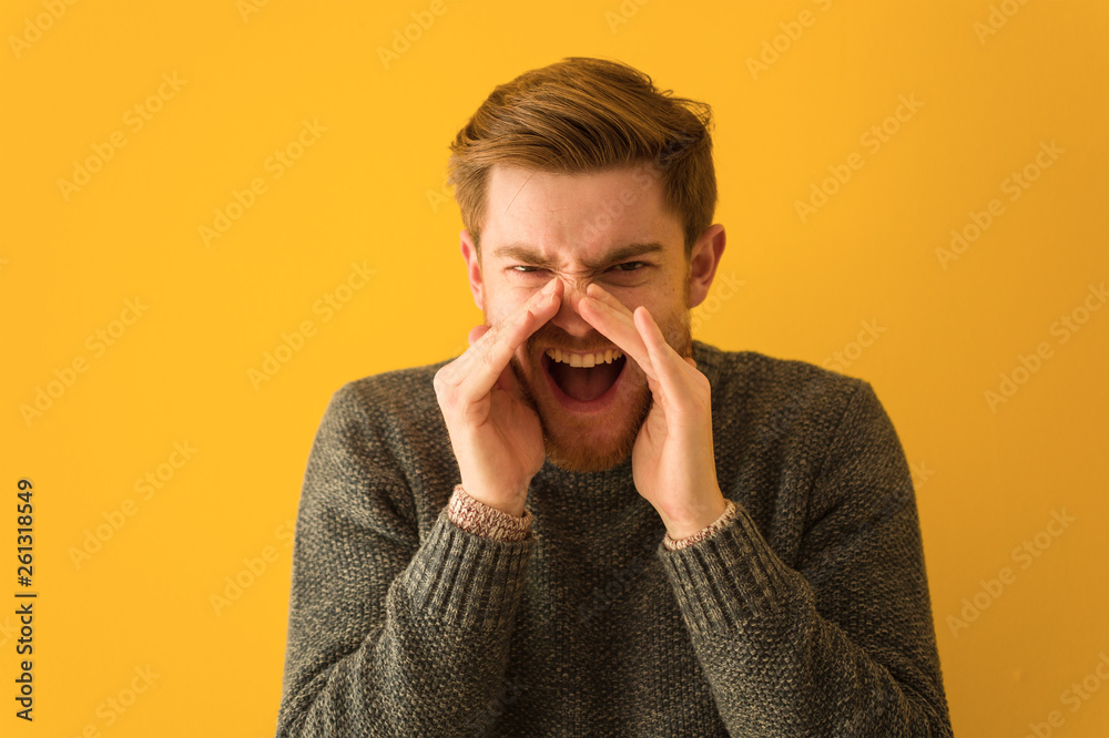 Young redhead man face closeup shouting something happy to the front Young redhead man face closeup shouting something happy to the front