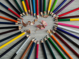 Office accessories: Color pencils and shavings on wooden gray table. Back to school. Top view