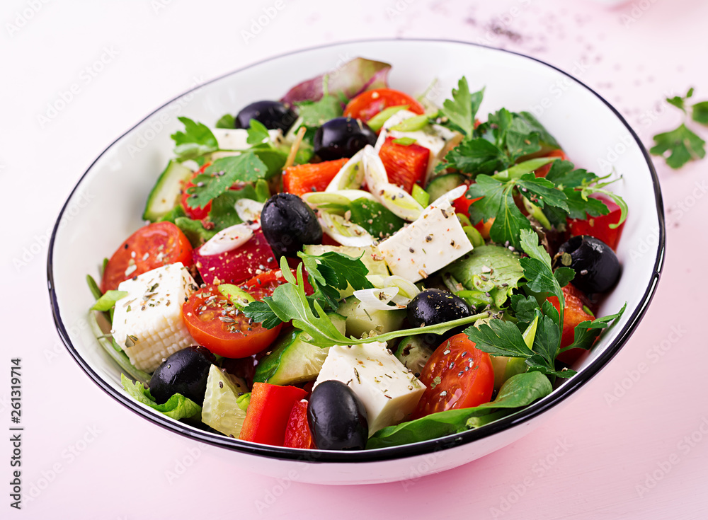 Greek salad with cucumber, tomato, sweet pepper, lettuce, green onion, feta cheese and olives with olive oil. Healthy food. Greek salad with cucumber, tomato, sweet pepper, lettuce, green onion, feta cheese and olives with olive oil. Healthy food.