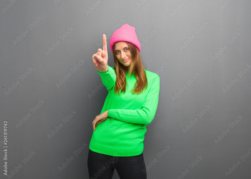 Young natural russian girl showing number one Young natural russian girl showing number one