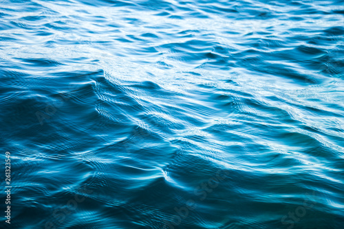 Seawater background. Blue water texture.