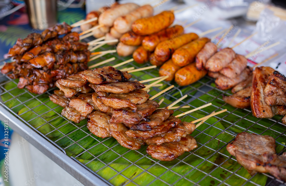 food stall, street food at night market walking street, pile of sausages and meat balls