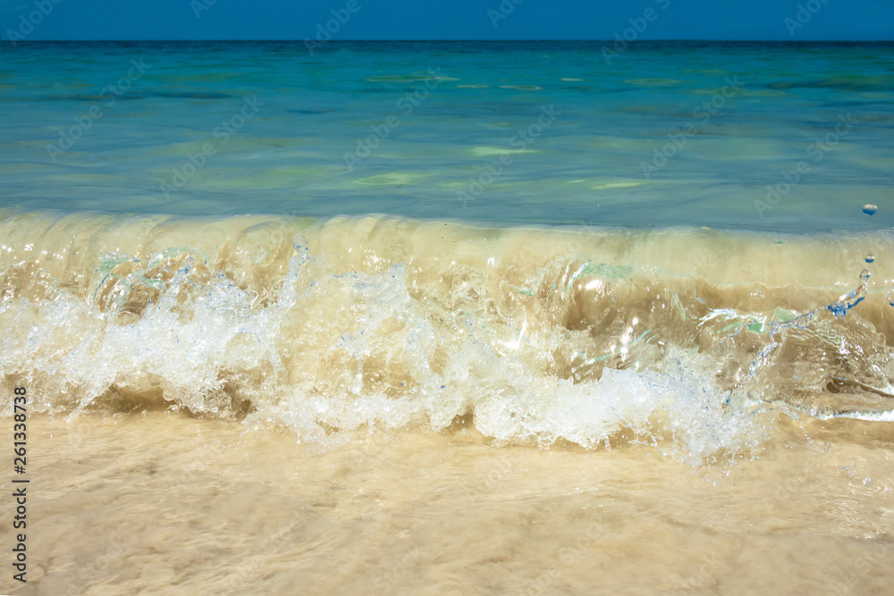 Tropical summer sea wave, sand beach and sky