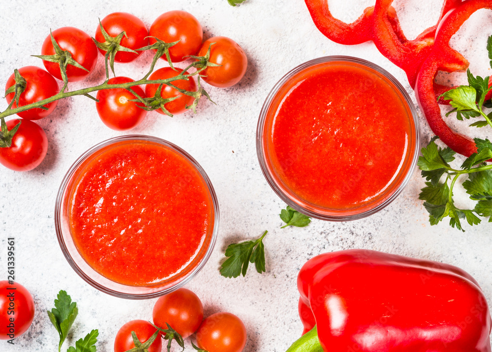Tomato vegetable juice in glass on white. Tomato vegetable juice in glass on white.