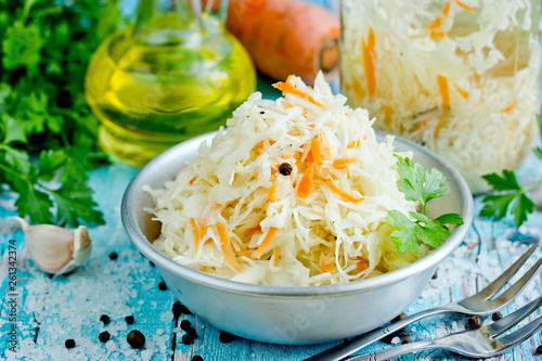 Homemade sauerkraut with carrot and spices, sweet and sour white cabbage